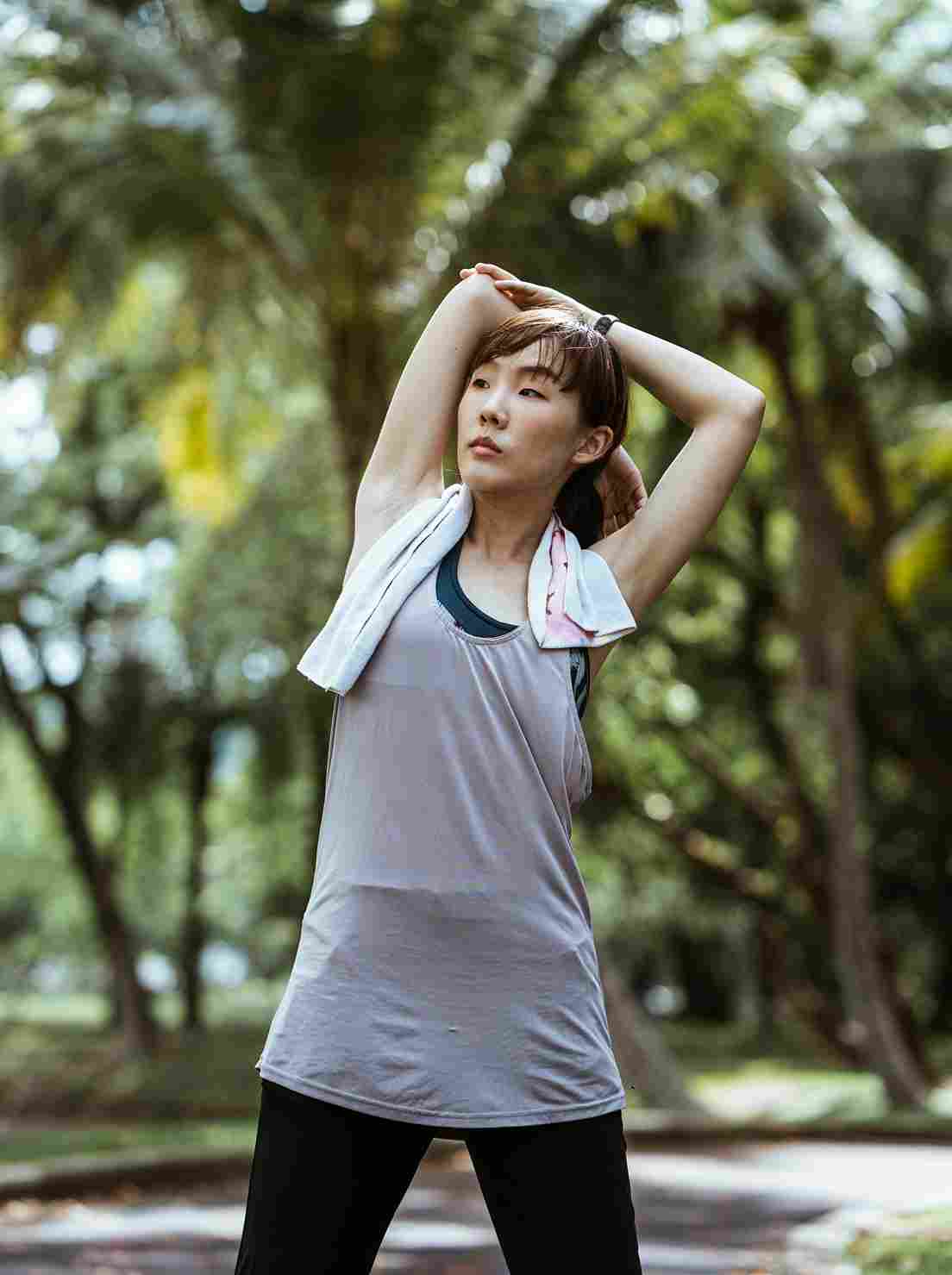 Woman warming up and stretching before a run